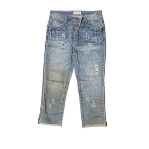 Button up distressed jeans with patches covering holes